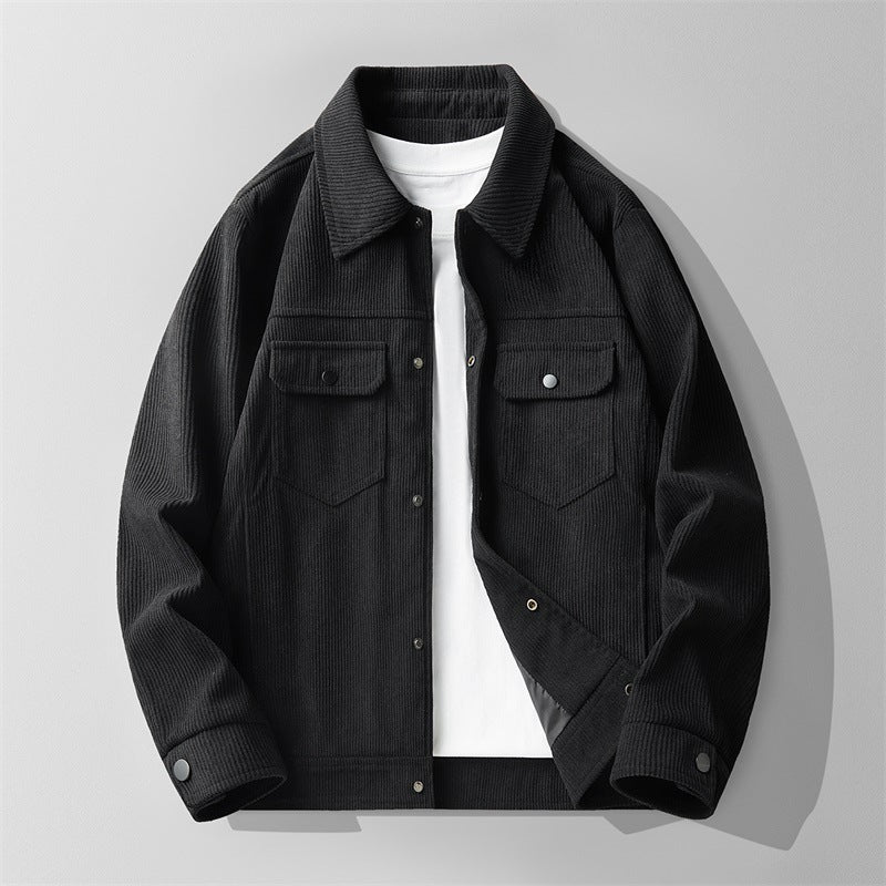 Black men's corduroy jacket with buttoned front pockets over white t-shirt on gray background