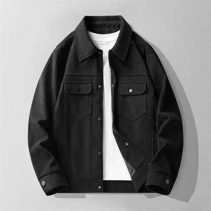 Black men's corduroy jacket with snap buttons over white T-shirt on gray background