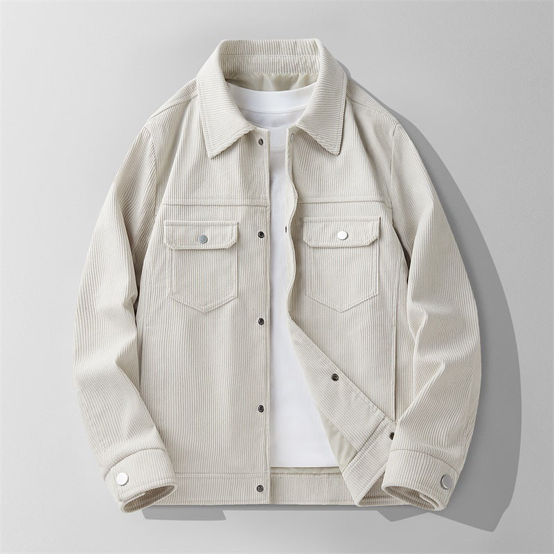 Men's light beige corduroy jacket with buttoned chest pockets and snap closures over white tee
