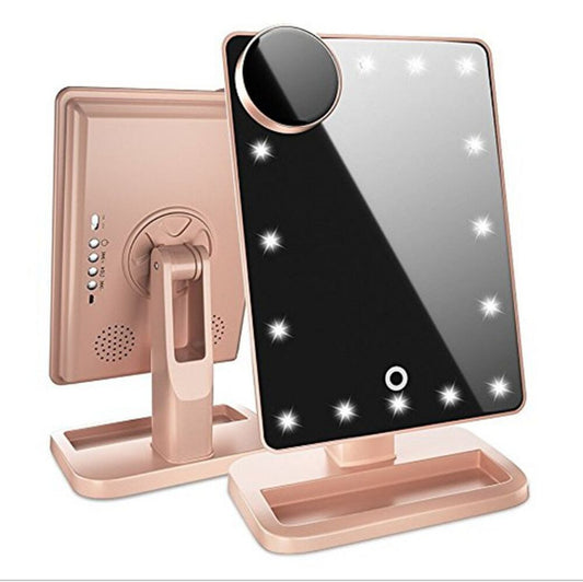 Rose gold LED vanity mirror with Bluetooth speaker, 10x magnifying mirror, and touch sensor