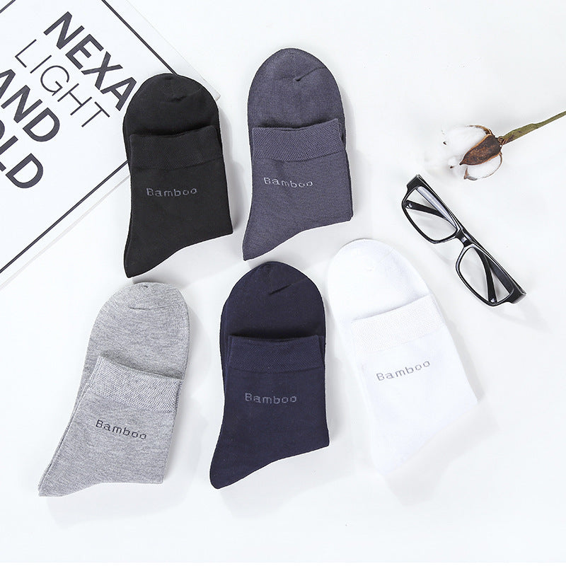 Five pairs of mid-calf bamboo blend socks in black, gray, navy, white, and dark gray with text 'Bamboo' displayed on white background with eyeglasses and cotton flower