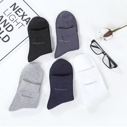 Five pairs of mid-calf bamboo blend socks in black, gray, navy, white, and dark gray with text 'Bamboo' displayed on white background with eyeglasses and cotton flower