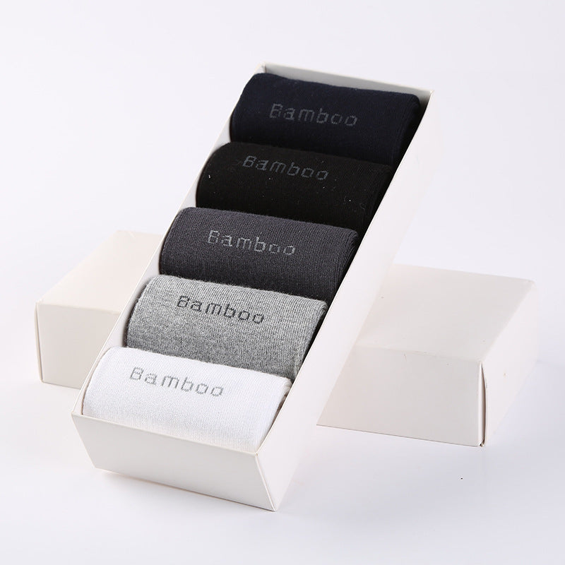 Pack of five mid-calf bamboo socks in black, navy, gray, light gray, and white in white box