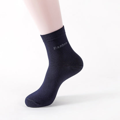 Black mid-calf bamboo socks on a mannequin foot, soft cotton blend with antibacterial odor control