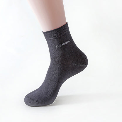Black mid-calf bamboo socks on mannequin foot, soft cotton blend material