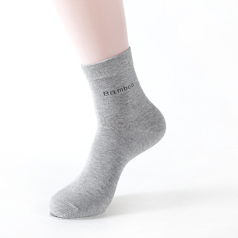 Grey mid-calf bamboo socks on a mannequin foot with text 'bamboo' on the side