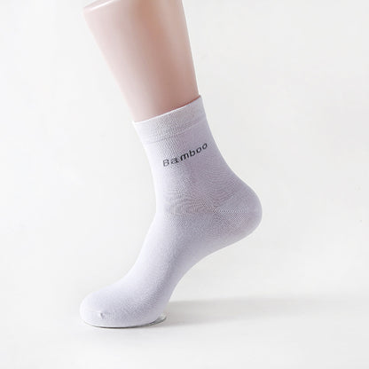 White mid-calf bamboo socks displayed on a mannequin foot with 'Bamboo' text on the cuff