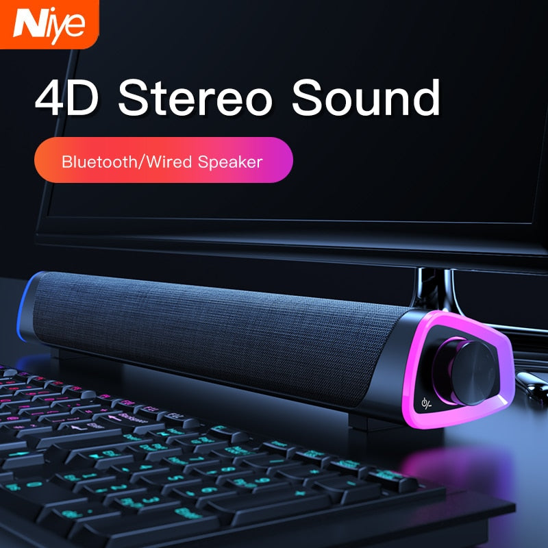 Niye 4D stereo Bluetooth/wired soundbar speaker with RGB lighting on desk with keyboard and monitor