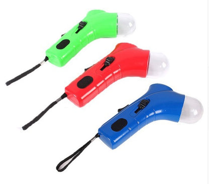 Green, red, and blue portable pet treat launchers with ergonomic grips and wrist straps on white background