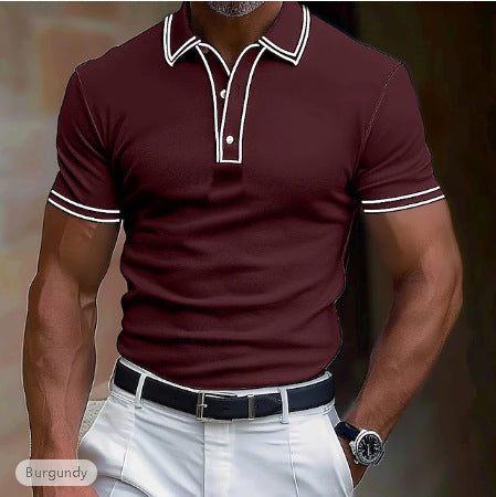 Man wearing burgundy short sleeve polo shirt with white trim, white pants, black belt, and watch