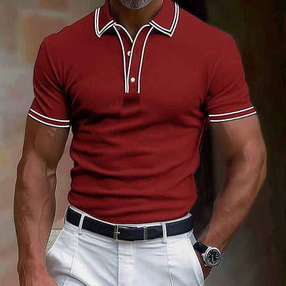 Man wearing fitted maroon short sleeve polo shirt with white trim and white pants with black belt