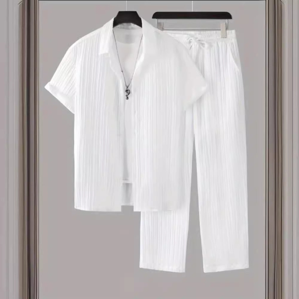 White men's casual two-piece set with short-sleeve shirt and pants on hangers