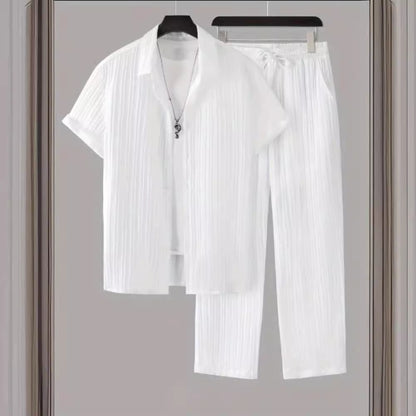 White men's casual two-piece set with short-sleeve shirt and pants on hangers