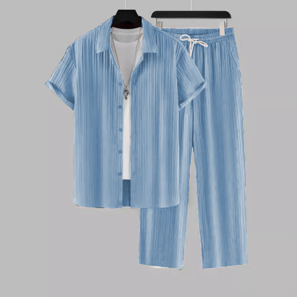 Light blue men's casual two-piece set with short-sleeve shirt and drawstring pants on hangers