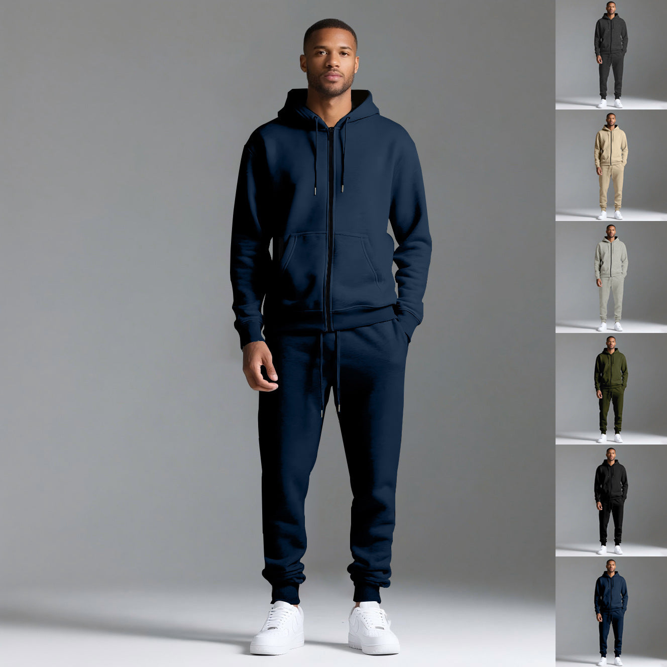Male model wearing navy blue cotton blend hooded sportswear tracksuit set with white sneakers