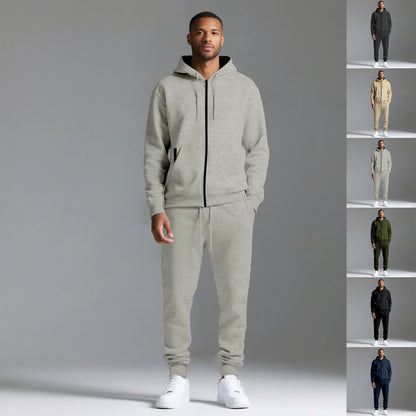 Man wearing light gray hooded cotton blend tracksuit with zip-up jacket and joggers