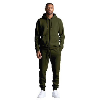 Man wearing olive green hooded zip-up sweatshirt and matching jogger pants with white sneakers