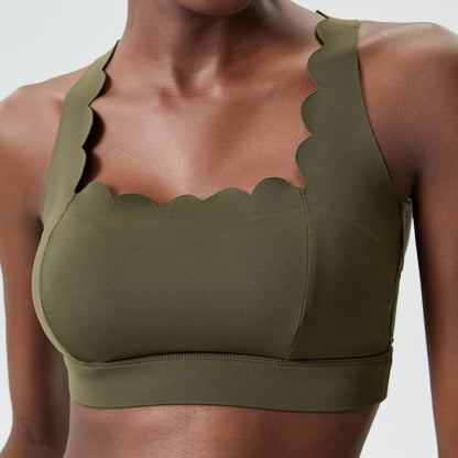 plus size olive green sports bra with scalloped neckline on dark skin woman
