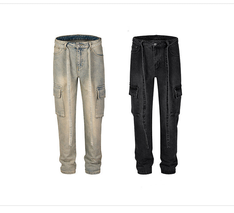 Pair of men's distressed denim cargo pants in beige and black with straight legs and side pockets