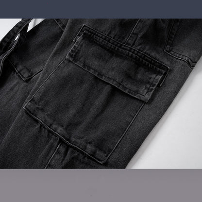 Close-up of black washed distressed denim jeans with large flap pockets