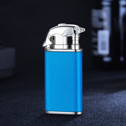 Blue metal cigar lighter with silver flame-shaped windproof top on dark surface