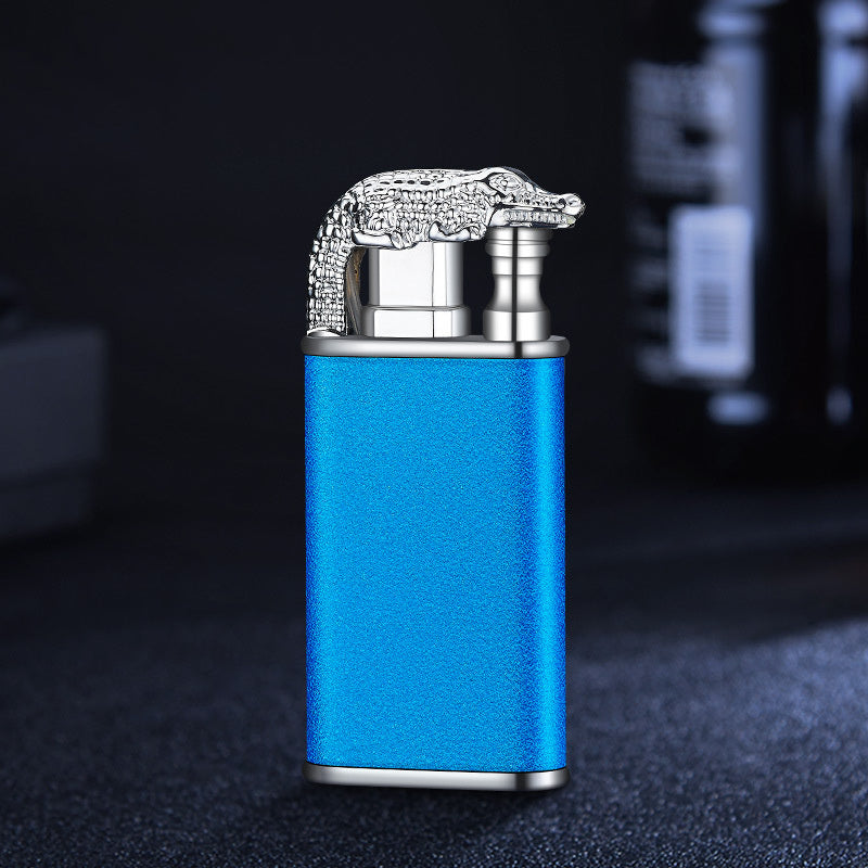 Blue metal windproof double flame lighter with detailed silver crocodile design on top