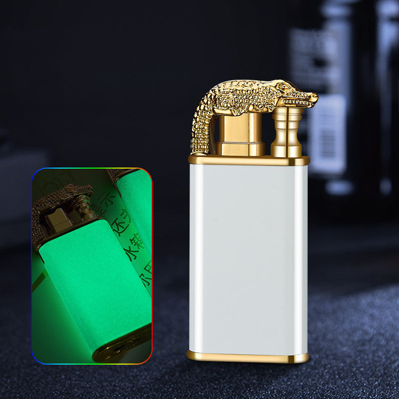 metal cigar lighter with golden crocodile design and white body, windproof double-flame lighter, glowing green in dark