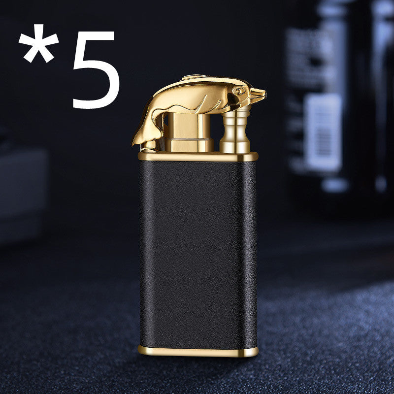 Black and gold metal cigarette lighter with dolphin-shaped top and textured grip