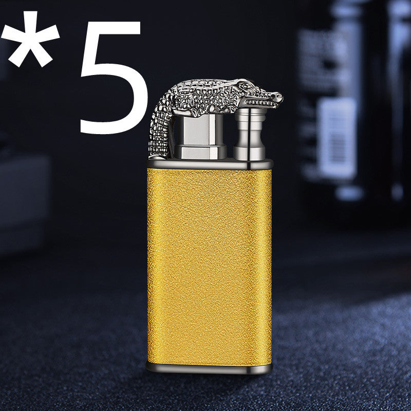Gold metal double flame windproof lighter with detailed silver crocodile design on top