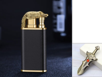 Black and gold windproof metal cigar lighter with a detailed crocodile design on top