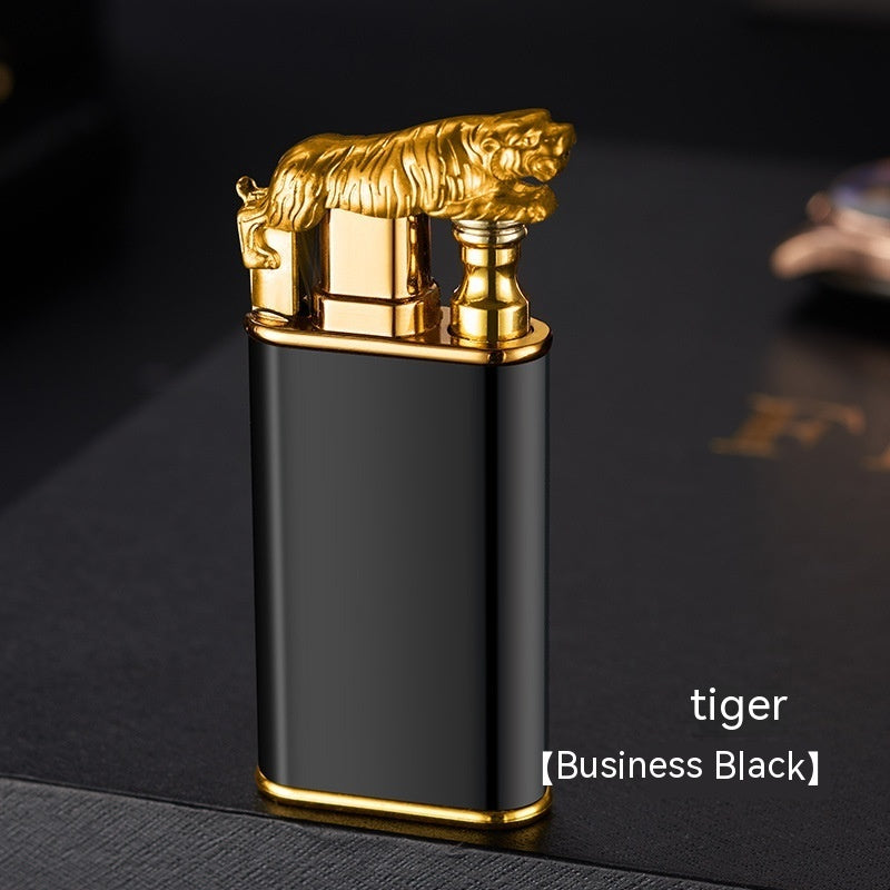 Black and gold metal lighter with a golden tiger figure on top, sleek design, luxury cigar accessory
