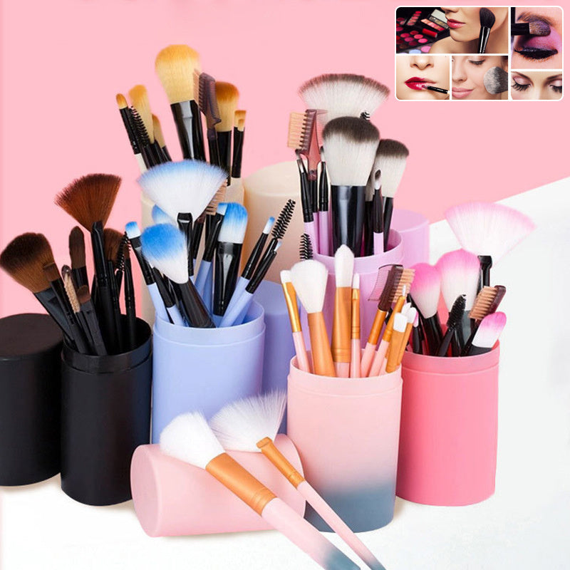 12-piece colorful makeup brush set with soft bristles in pastel holders on pink background