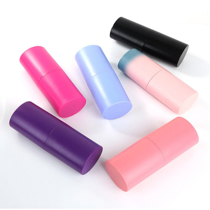 Six colorful makeup brush holders in black, pink, purple, blue, and gradient pink-blue on white background