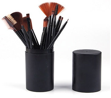 12-piece black makeup brush set with soft bristles in cylindrical holder with lid