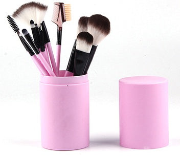 12-piece pink makeup brush set with soft bristles in a pink cylindrical holder with lid