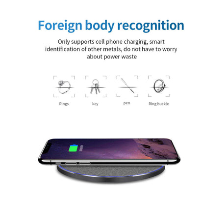 Wireless charger with smartphone on top showing charging, highlighting foreign body recognition for rings, keys, pens