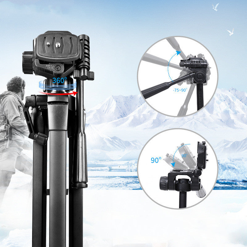 Black aluminum camera tripod with 360° rotating head and adjustable tilt angles shown in snowy mountain background