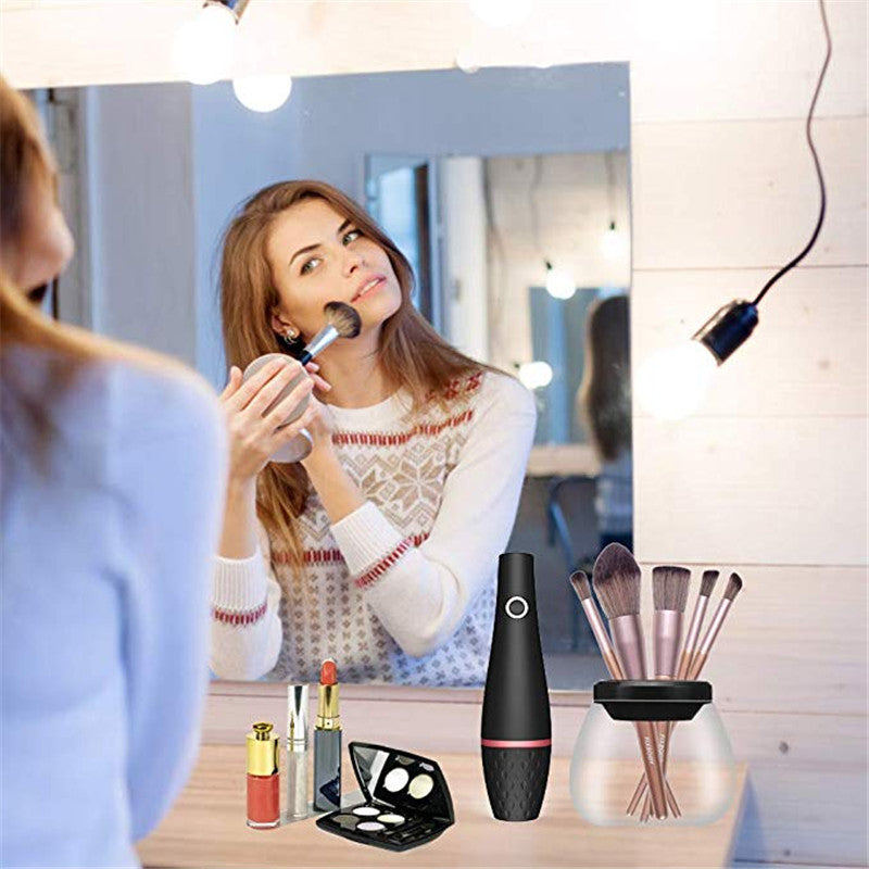 Woman applying makeup using brush at vanity with various makeup products and brush cleaner