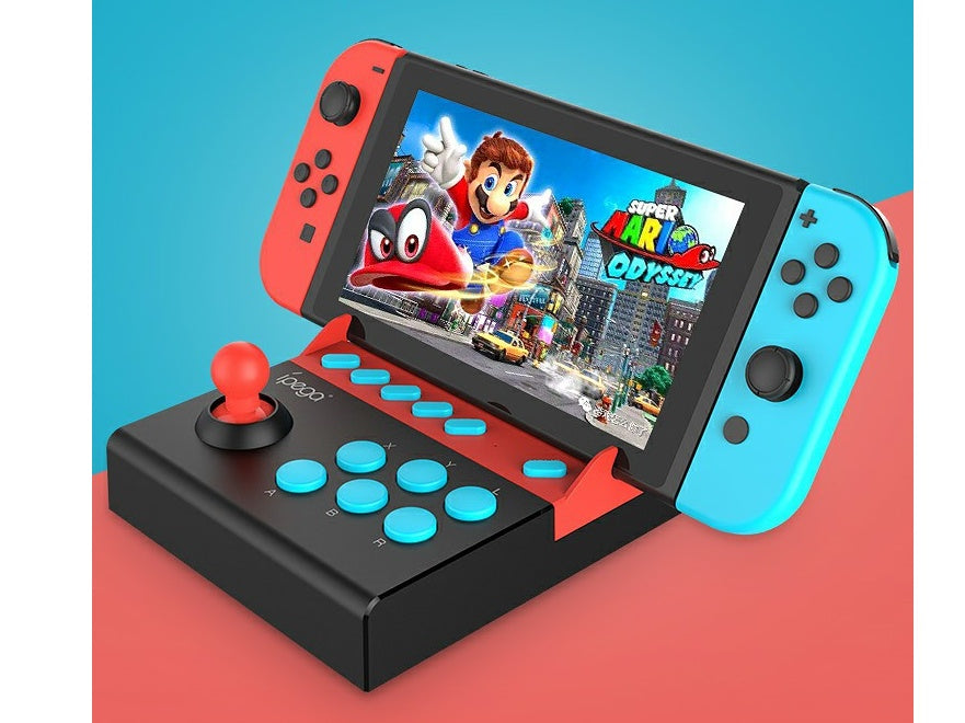 Nintendo Switch with red and blue Joy-Con controllers on a black and red arcade-style fighting stick controller, playing Super Mario Odyssey