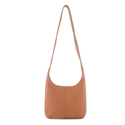 Tan genuine leather casual women's crossbody bag with long strap on white background