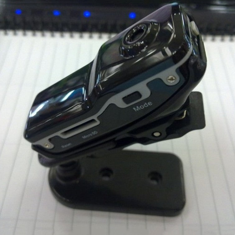 Black Trendoligy mini HD DV camera mounted on a small black stand on a white surface