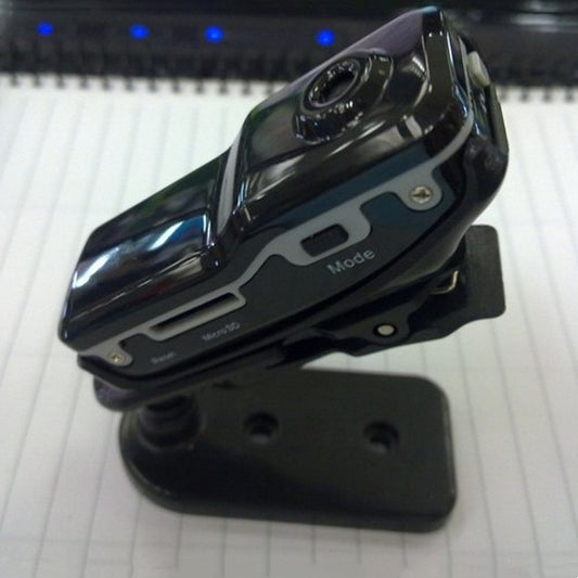 Black Trendoligy mini HD DV camera mounted on a small black stand on a white surface