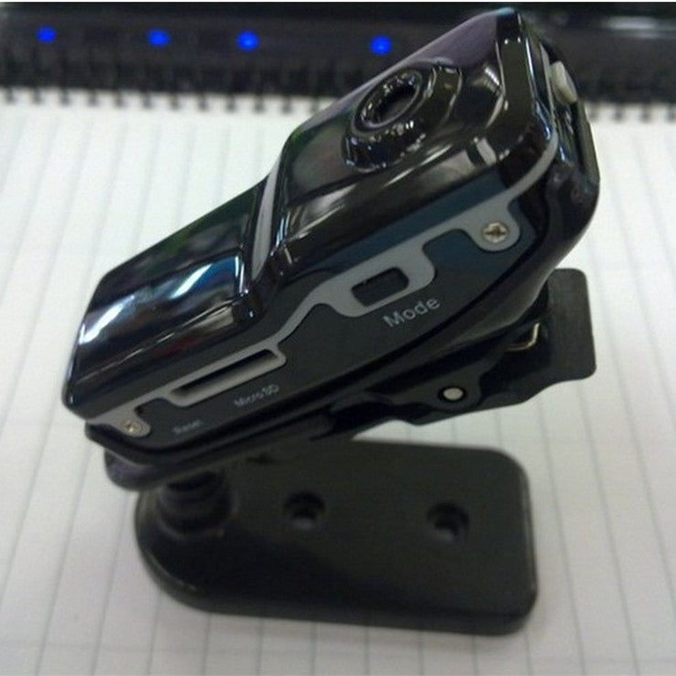 Black Trendoligy mini HD DV camera mounted on a black stand with mode and menu buttons