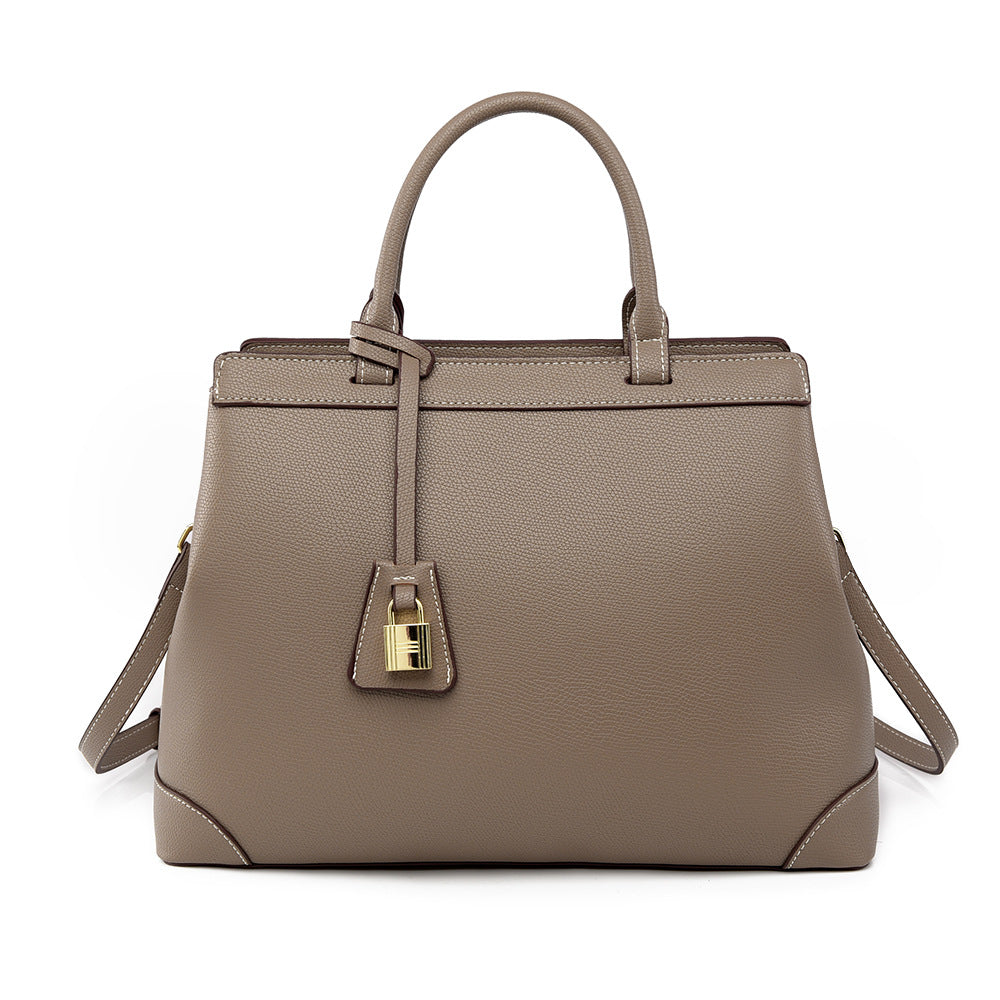 Taupe textured PU leather handbag with top handles and gold-tone lock detail