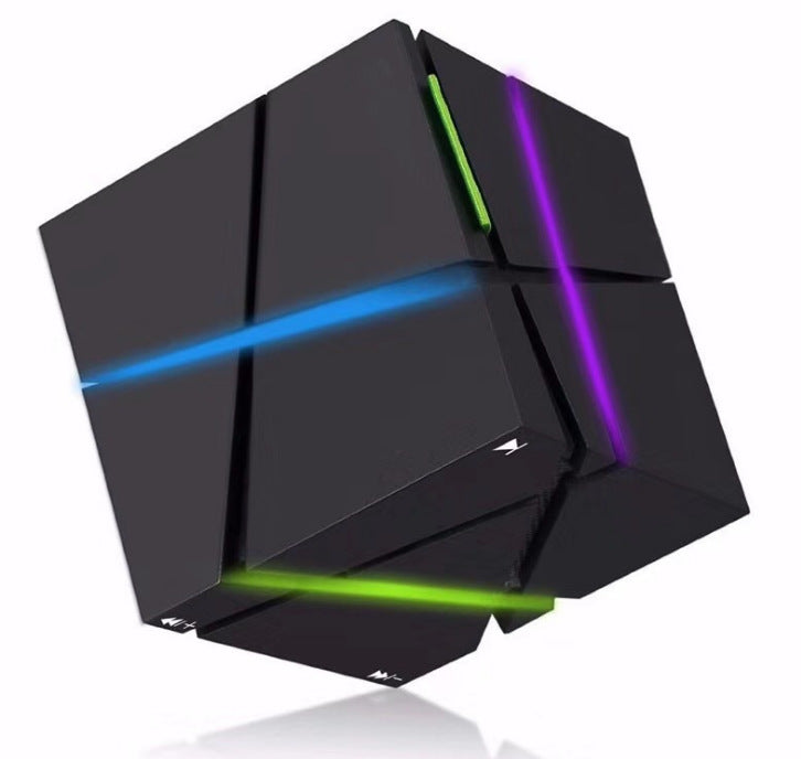 Black cube Bluetooth speaker with colorful LED light strips in blue, green, and purple