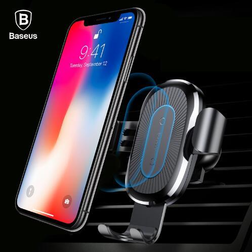Baseus black wireless fast car charger mount with auto gravity grip holding smartphone on air vent