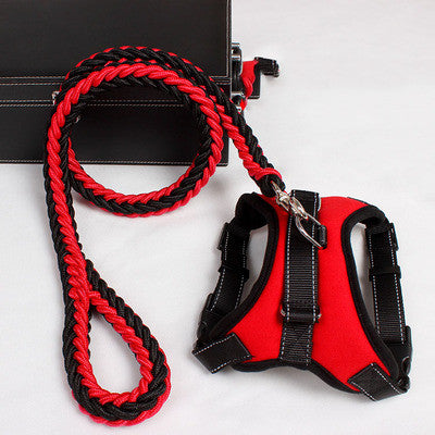 Red and black padded dog harness with adjustable straps and matching braided leash on white background