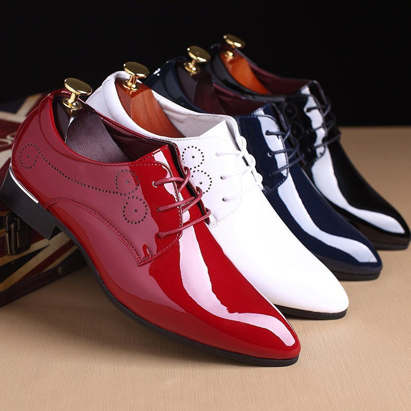 Glossy men's dress shoes in red, white, navy blue, and black with pointed toes and lace-up design
