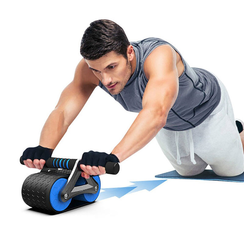 Man using blue and black ab roller wheel on mat for core workout and home gym training