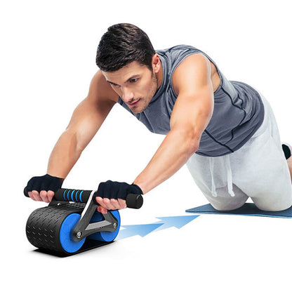 Man using blue and black ab roller wheel on mat for core workout and home gym training